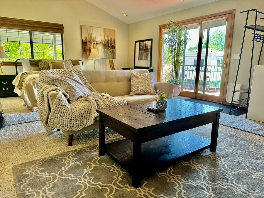 View from bedroom sitting area with lift top coffee table