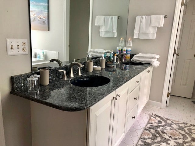 Double sink in master bath which also has a jacuzzi tub, separate shower, and separate commode.
Towels and starter amenities provided.