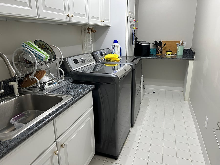 Laundry room with sink, full size washer and dryer