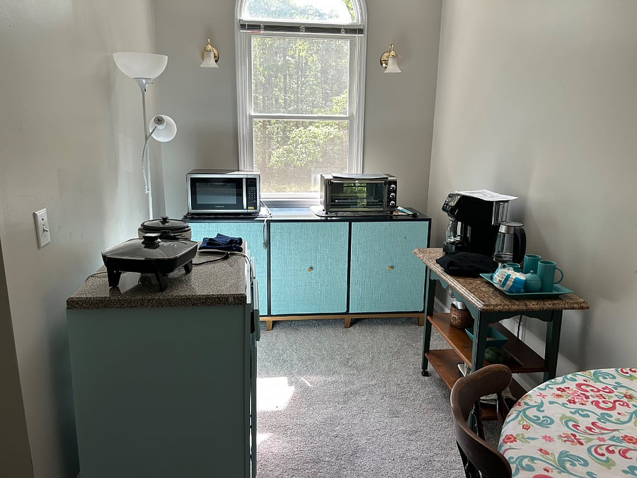Kitchenette area also includes a full size fridge and numerous electric appliances.