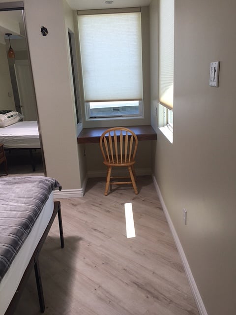 Private desk in bedroom to maintain business and financial needs while away from home