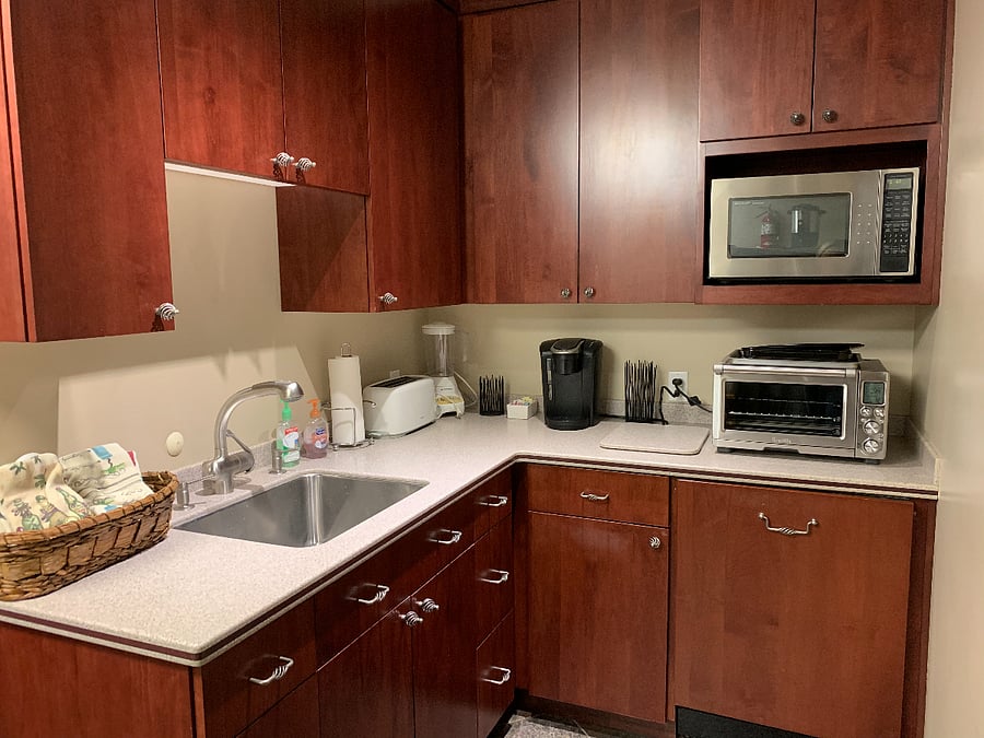 Kitchenette with two full refrigerators, microwave, dishwasher, Breveille oven and Cuisinart cooktop