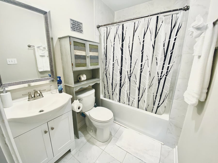 Full bath. first kid aid in the bath cabinet and iron under the bath sink.