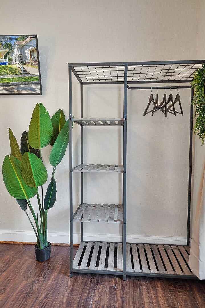 **Bedroom 1**: Extra Clothing Rack.