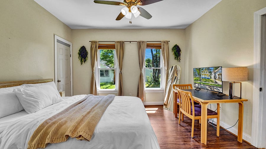 **Bedroom 2**: Features Blackout Curtains, High Ceilings, Full Closet, And Extra Storage Space Under The Bed.