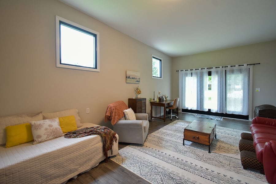 Second living room with day bed, a couch, rocking chair and workspace