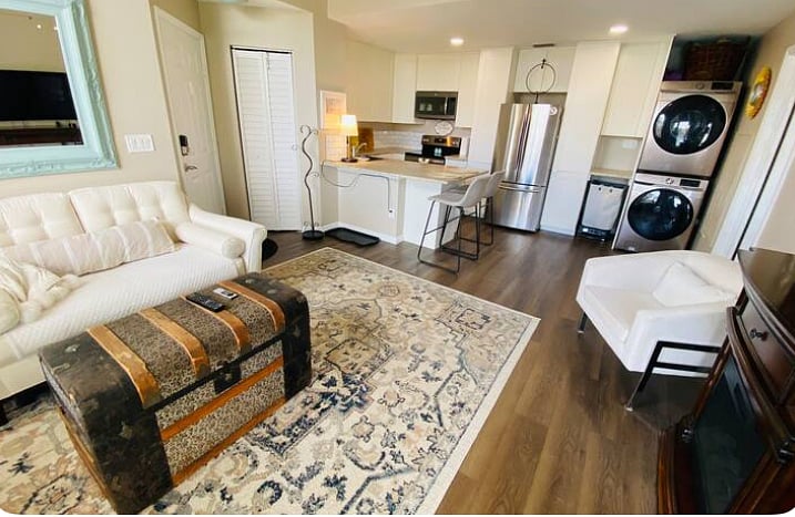 Full view of living room into kitchen