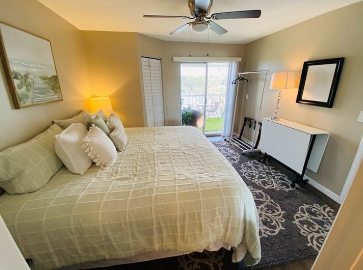 Memory foam king size mattress
with view of balcony and lake