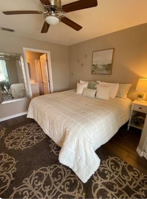 Bedroom with view into full bath
