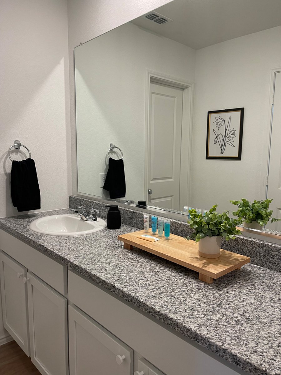 Master bathroom with ample counter space to hold your essentials to get ready for work or school!