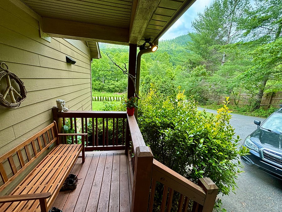Front covered entrance with a bench to put on/take off hiking boots.