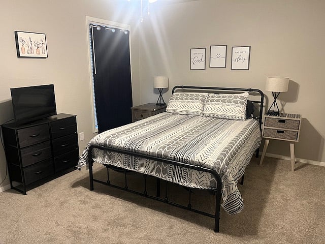 Downstairs bedroom with queen bed