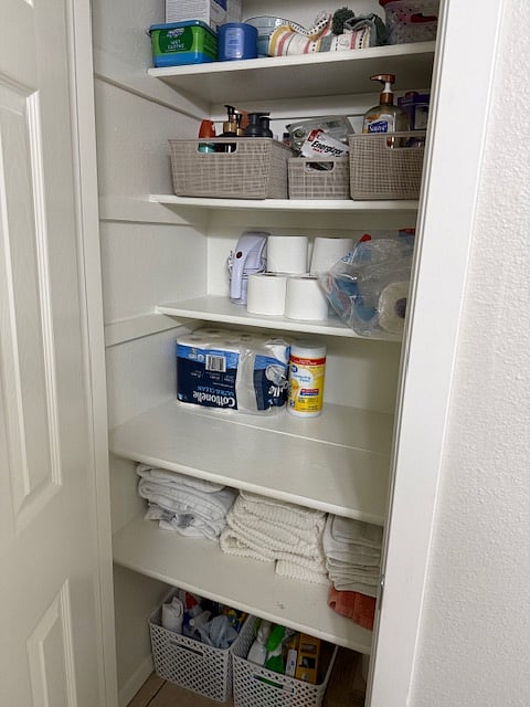 Upstairs bathroom closet with storage space