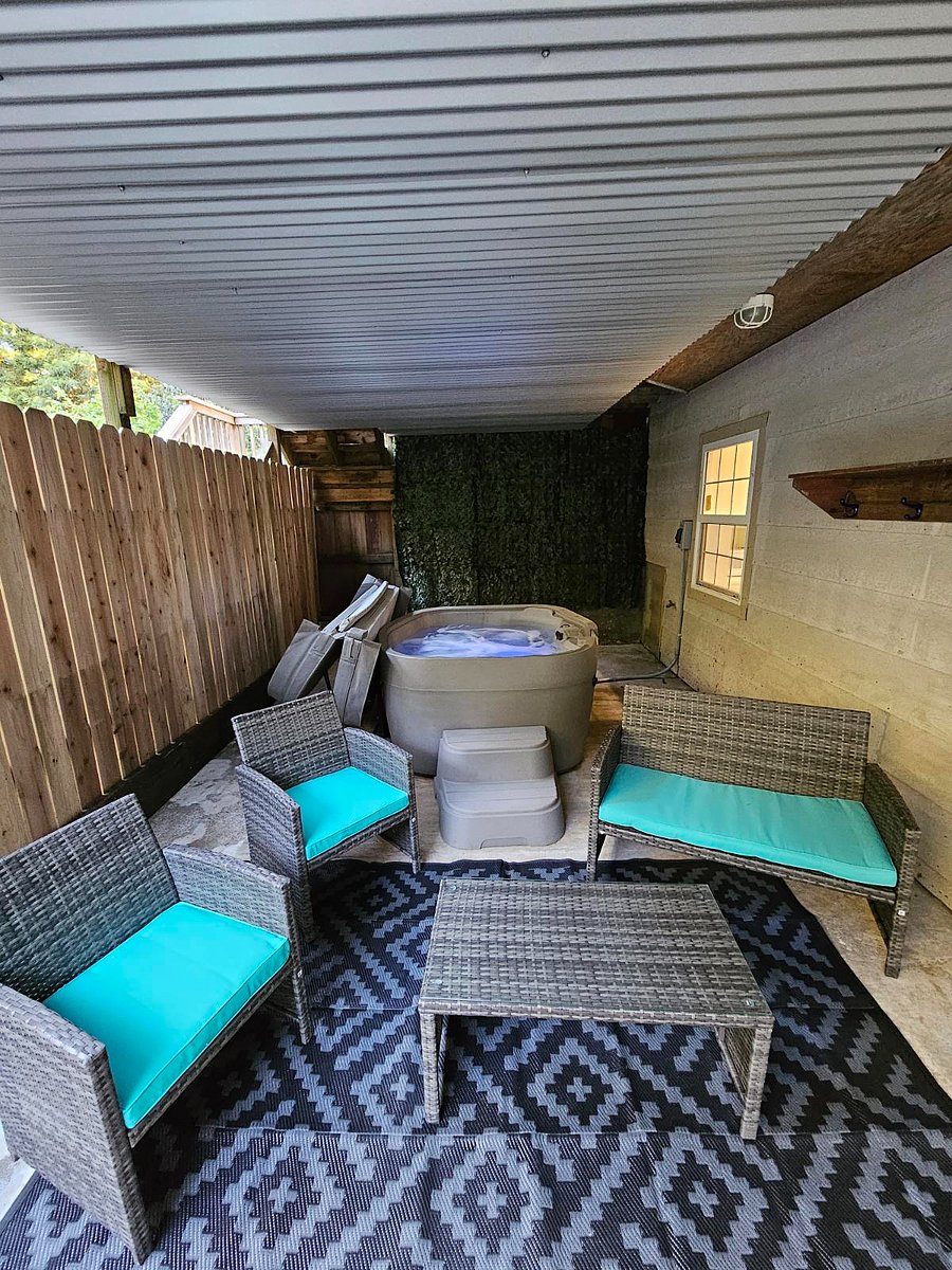 Covered patio with private hot tub