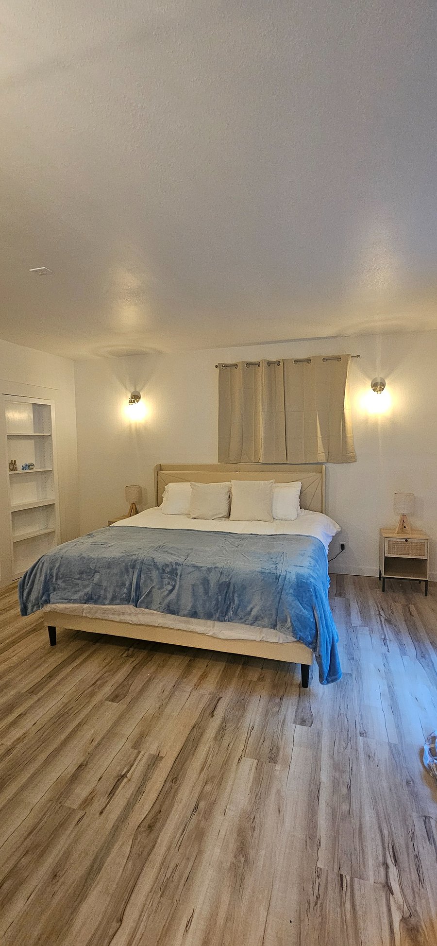 King size bed. Bedroom has sliding door to private outdoor space