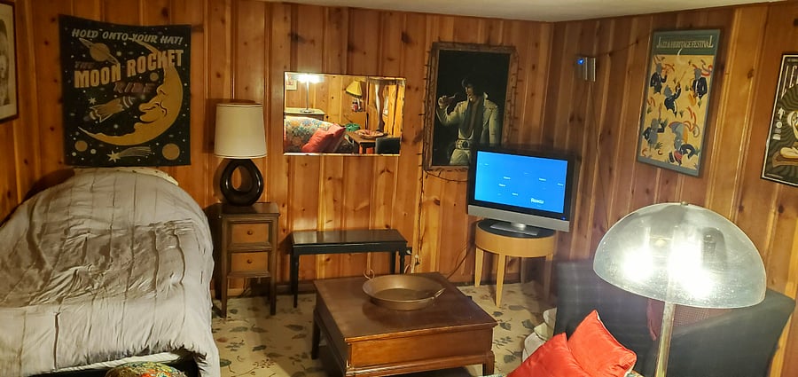 Basement/3rd Bedroom. In back of basement is a Fridge, Elliptical and Washer/Dryer