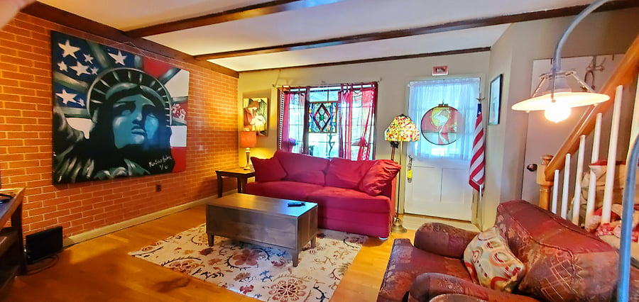 Living Room. The Coffee table lifts up so you can eat on the sofa.