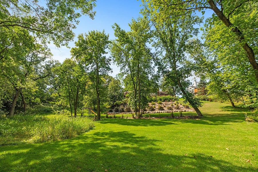 Huge 1 acre landscaped lot. 2 playgrounds for kids. Easy yard maintenance with sprinkler system front and back - schedule in place.