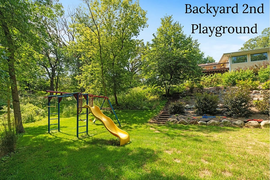 Huge 1 acre landscaped lot. 2 playgrounds for kids. Easy yard maintenance with sprinkler system front and back - schedule in place.