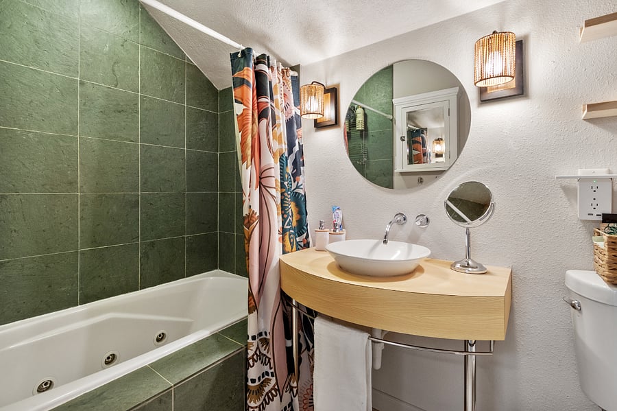 nice bathroom with ample shelving, storage for your items