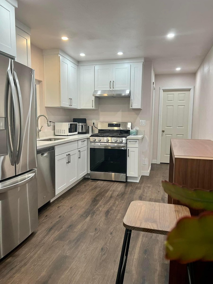 Kitchen with full size fridge, microwave, stove, oven, and air-fryer. 
*There is now a new dining room set.