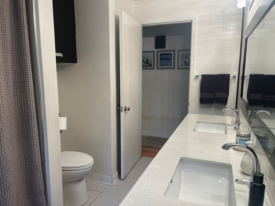 Double sink. Scale, lots of extra linens in linen closet, plenty of storage under sinks,