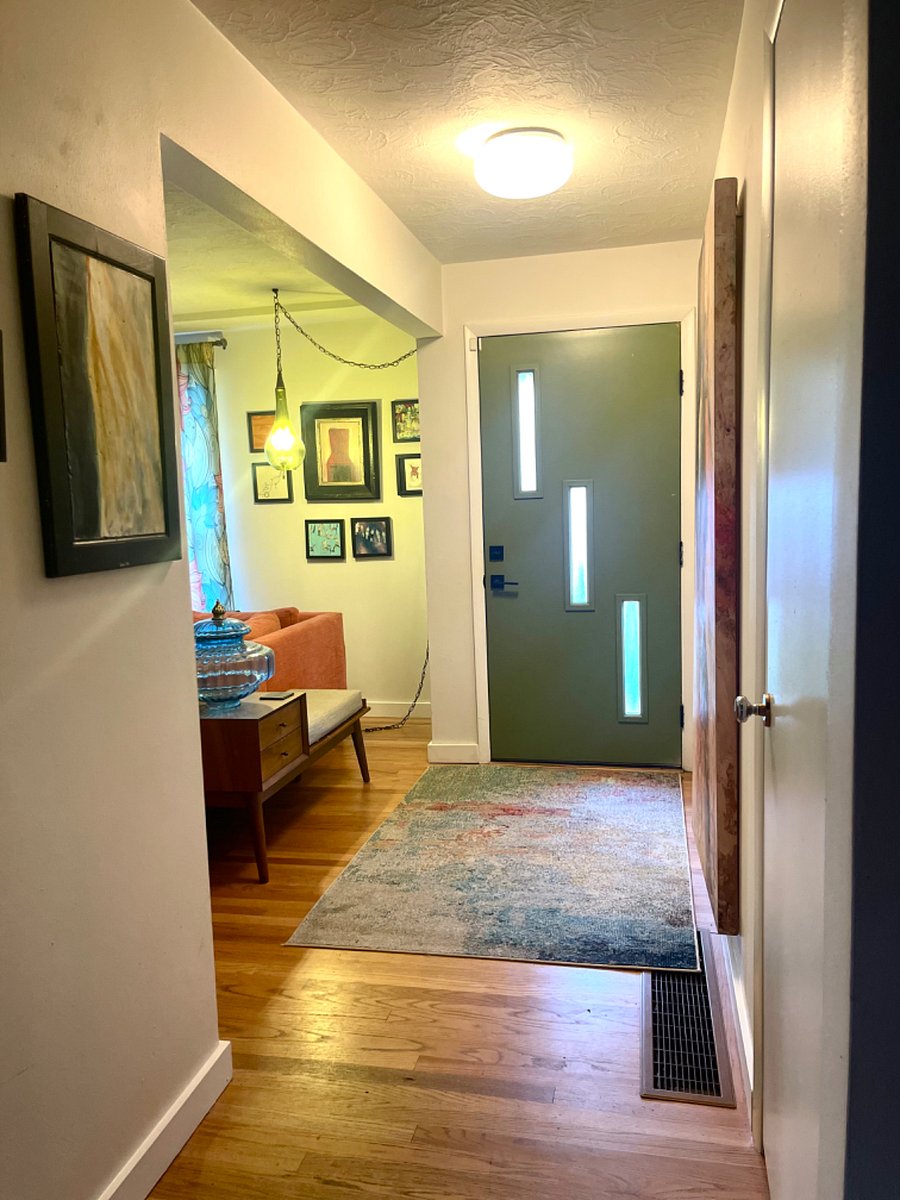 Front door and entry area with coat closet.