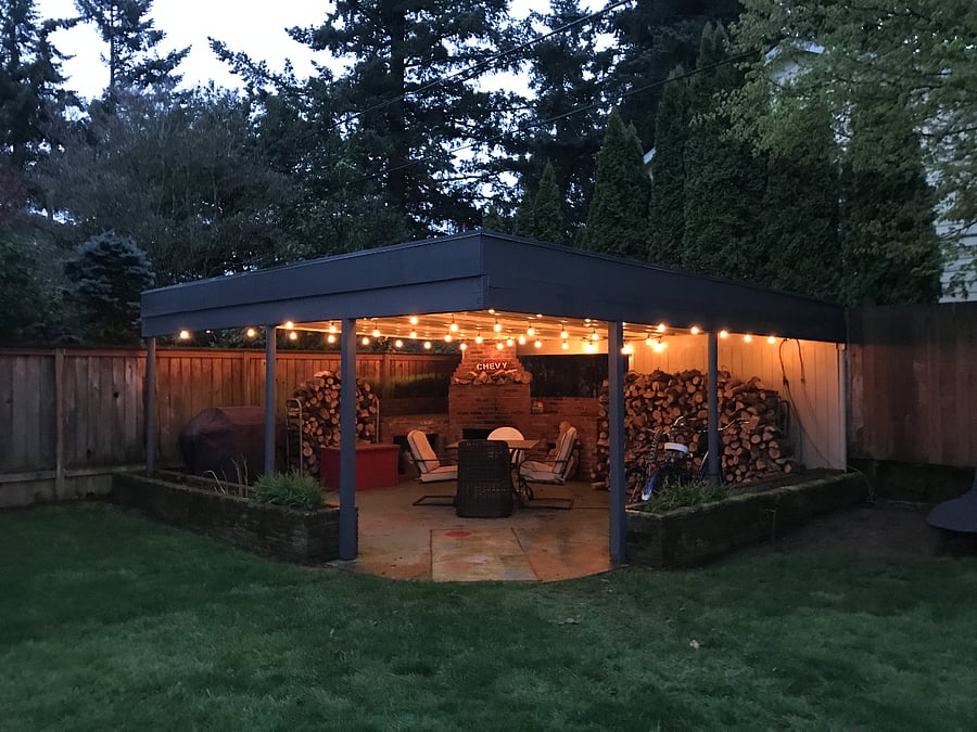 Shared covered patio in fully fenced in backyard. Fireplace, firewood, grill and furniture 