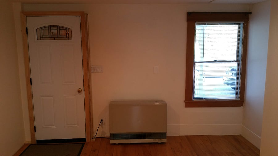 Private entry to unit. Large living room with new Rannai propane heat source.