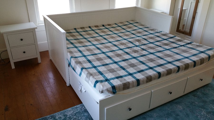 King-sized bed with two bedside tables.