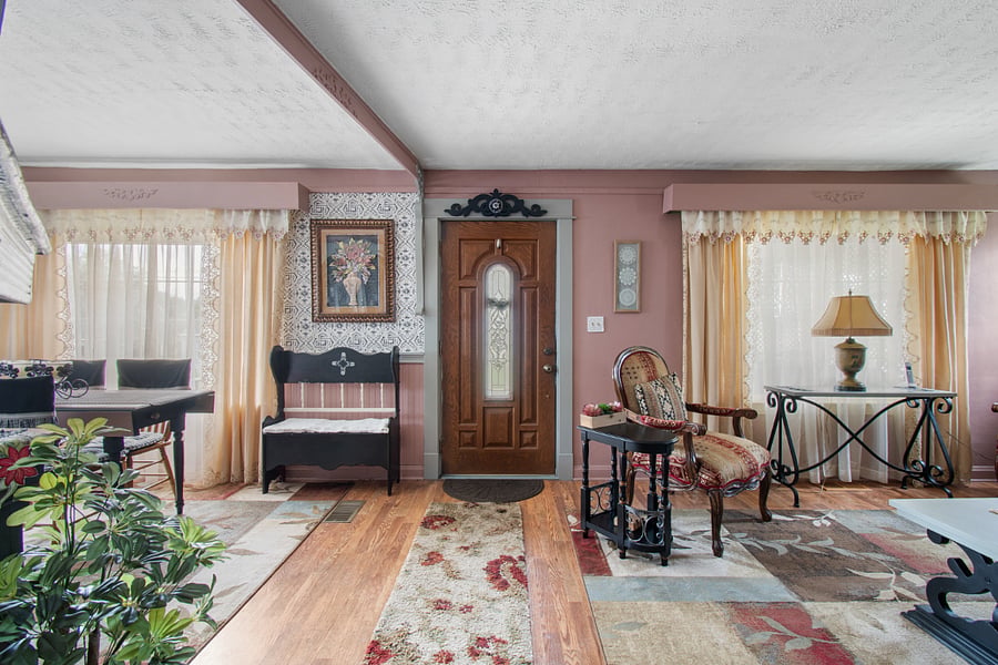 Front door entrance to cozy living room and dining room area