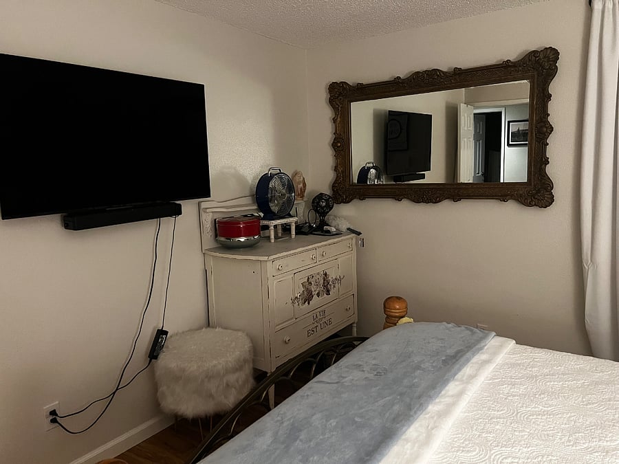 Master bedroom Smart TV, antique dresser with lamps with charging ports 