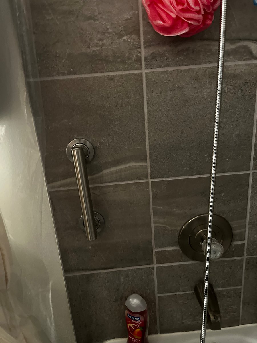 ADA safe Bathtub shower comb with smaller room. Located across hall