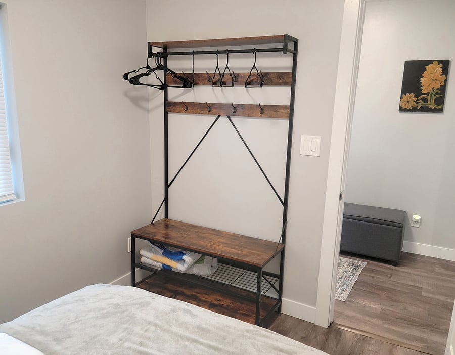 Secondary bedroom also includes hall tree for hanging clothes storage