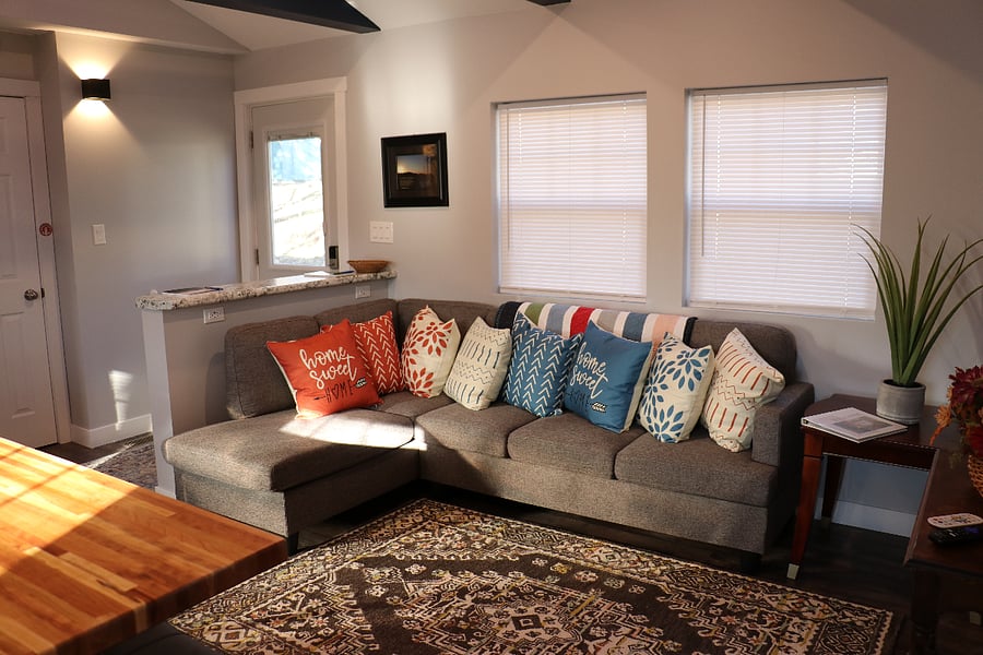 Open concept living room area with comfortable couch
