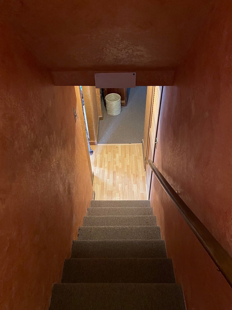 Stairway from kitchen to basement.