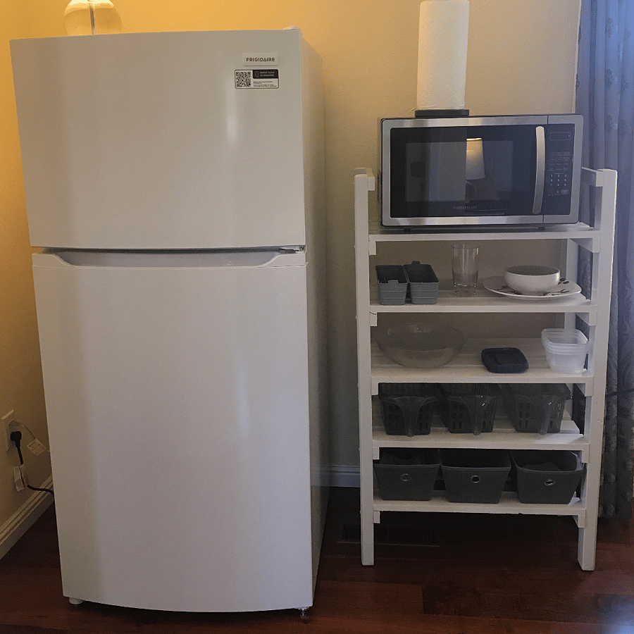 Full size fridge and freezer. Storage for food and kitchen accessories.