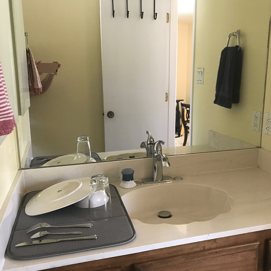 Sink, drying mat for dishes. Medicine cabinet and vanity provide lots of storage space.