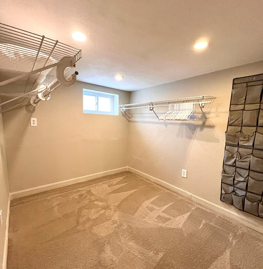 Large Walk-in closet in lower-level bedroom.