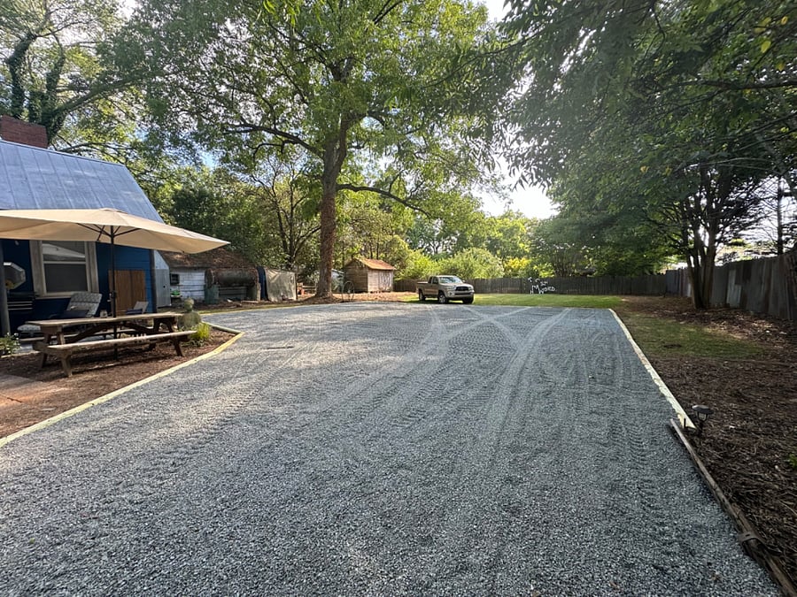 Recently upgraded gravel driveway with ample shared parking in back.