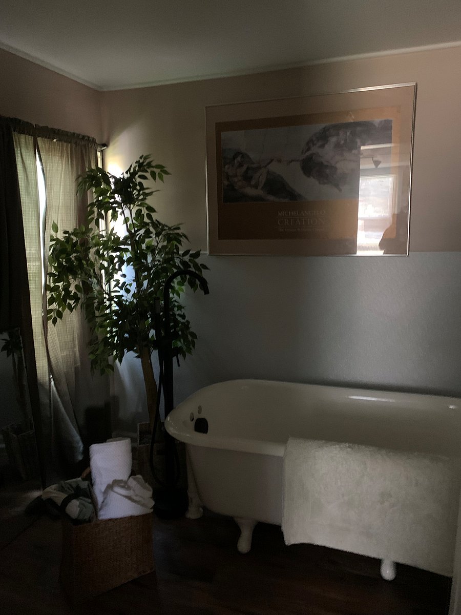 Master bathroom featuring beautifully restored soaking tub