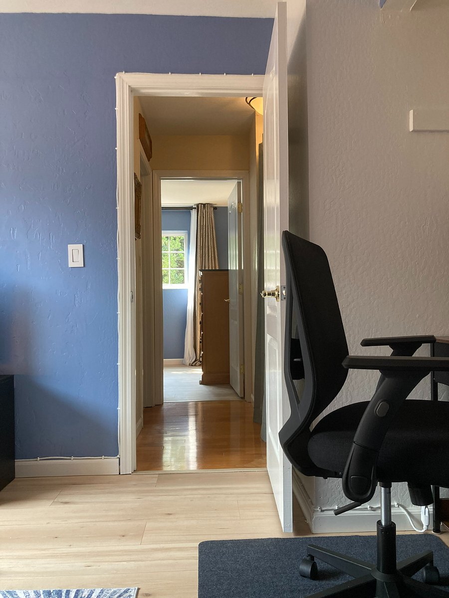 View from your living room into hallway. Bedroom in the background