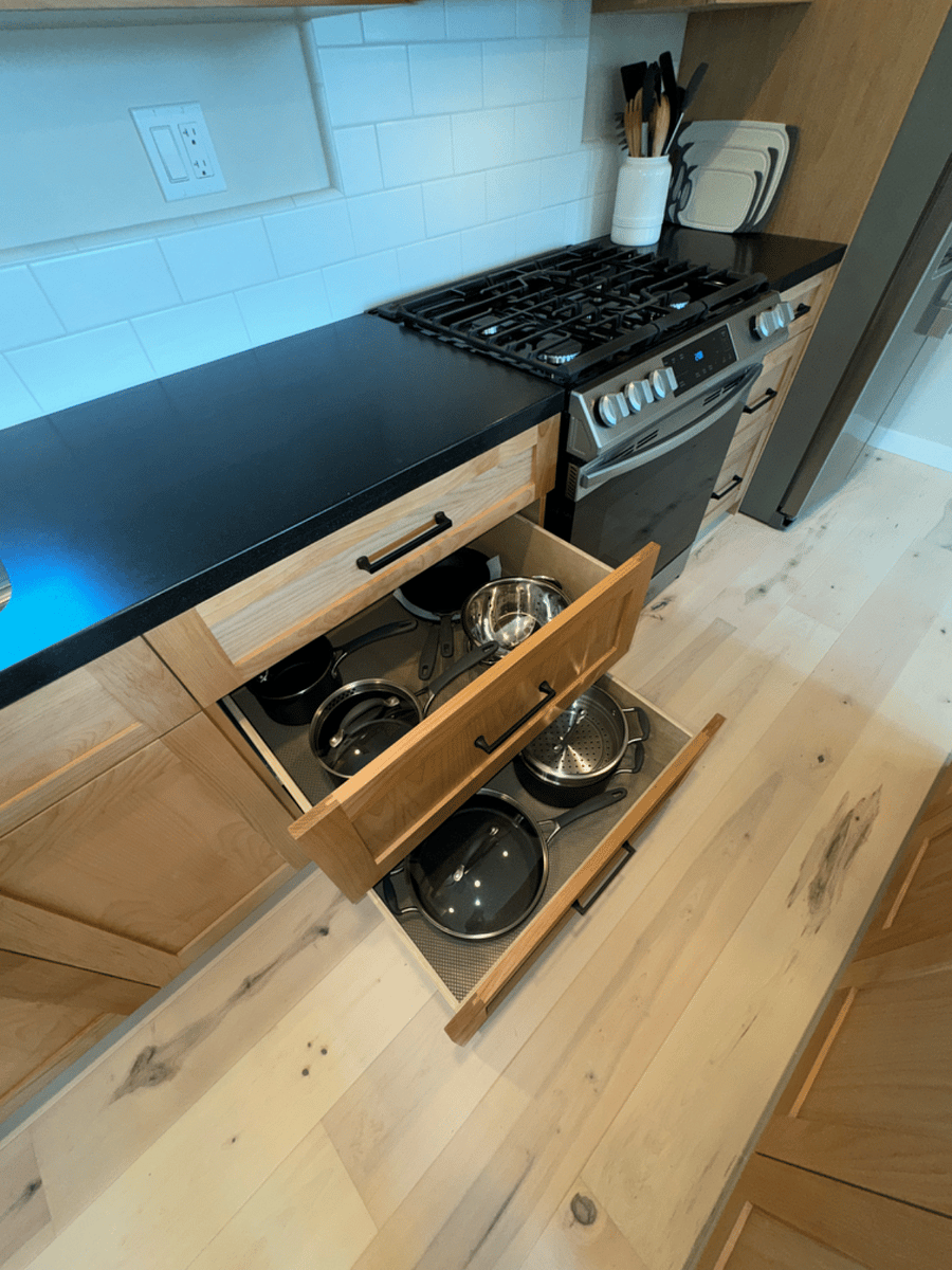 Full size stove and refrigerator with all of the cooking gear.