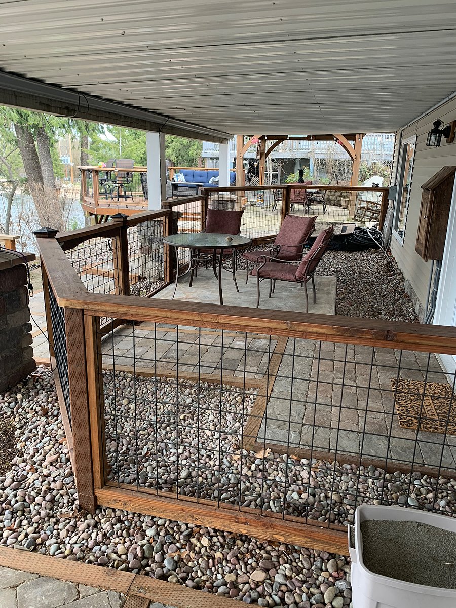 Private patio area with table and chairs.