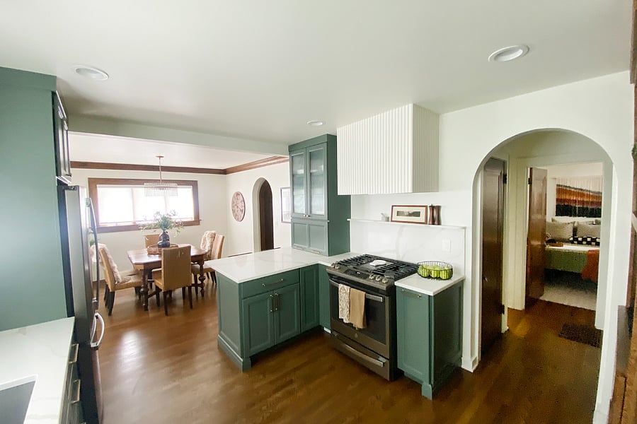 A spacious and elegant kitchen bathed in natural light, featuring quartz countertops, a gas stove, and fully equipped with everything you need to prepare a fantastic meal.