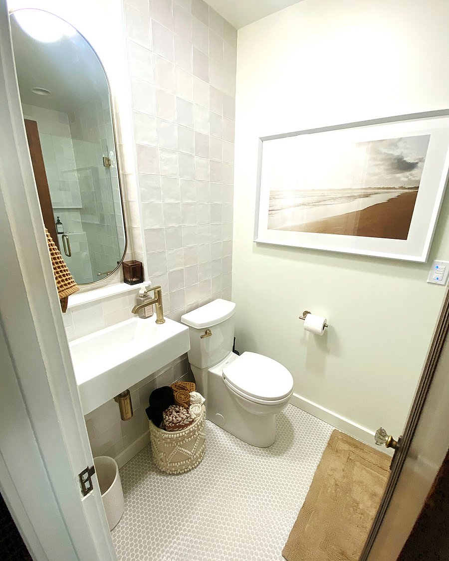 The ground floor bathroom, conveniently located just steps from the kitchen and main floor bedroom, features beautiful handmade tile throughout. Enjoy the beautiful walk in shower and all the essential amenities youd expect from a boutique hotel.