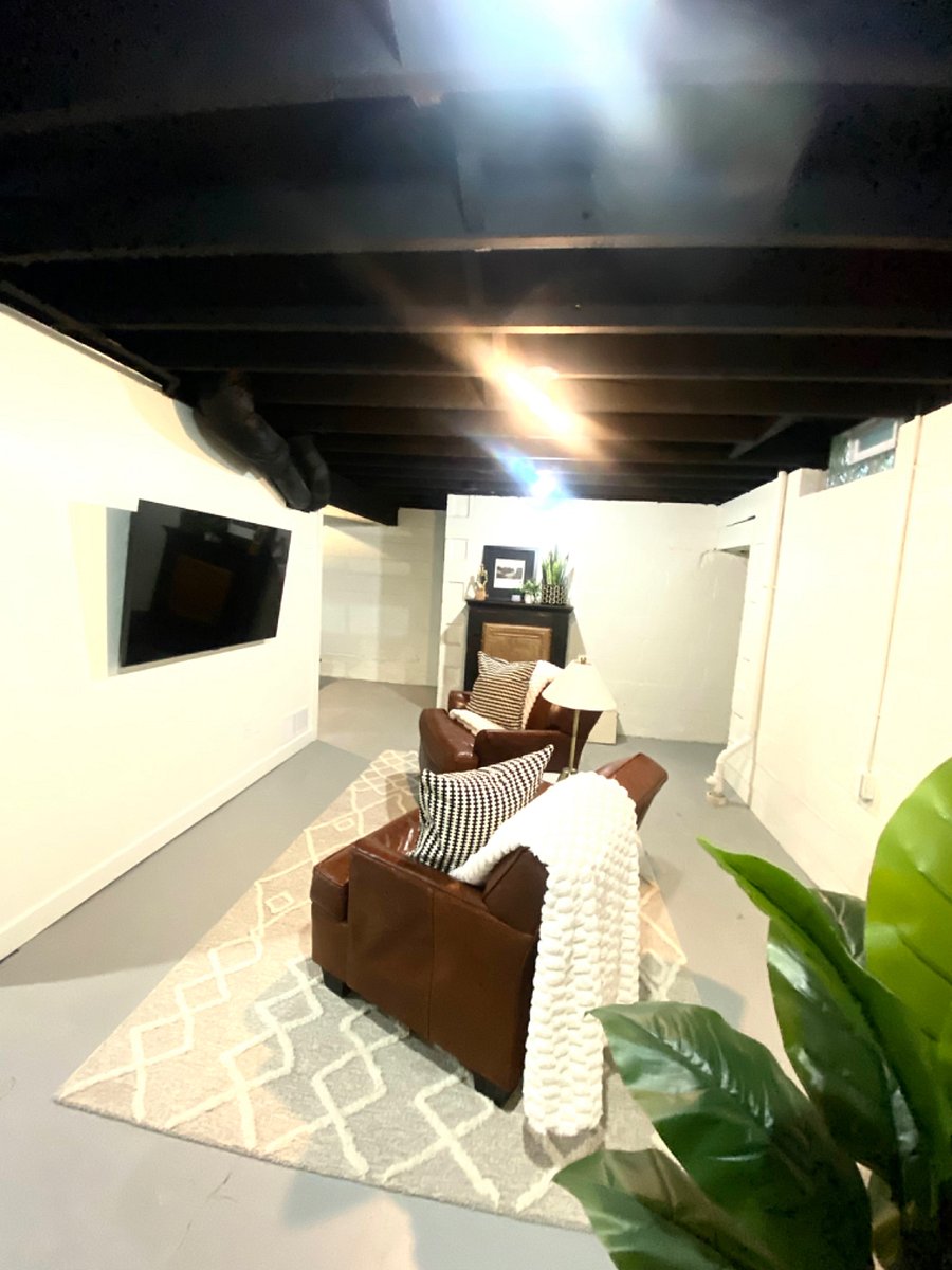 The downstairs game room boasts a 55-inch smart TV with an HDMI wall plug for easily connecting your video game console. Cabinet is stocked with puzzles and board games for your entertainment.