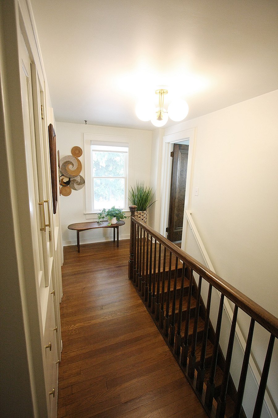 Upstairs hallway connecting bedrooms and bathroom.