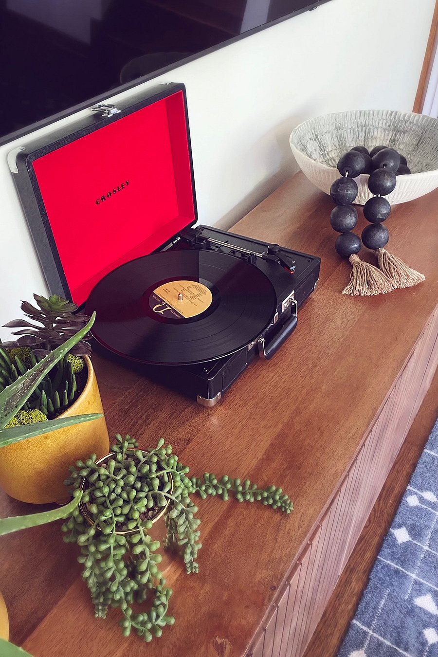 Record player with a curated collection of records for your listening pleasure
