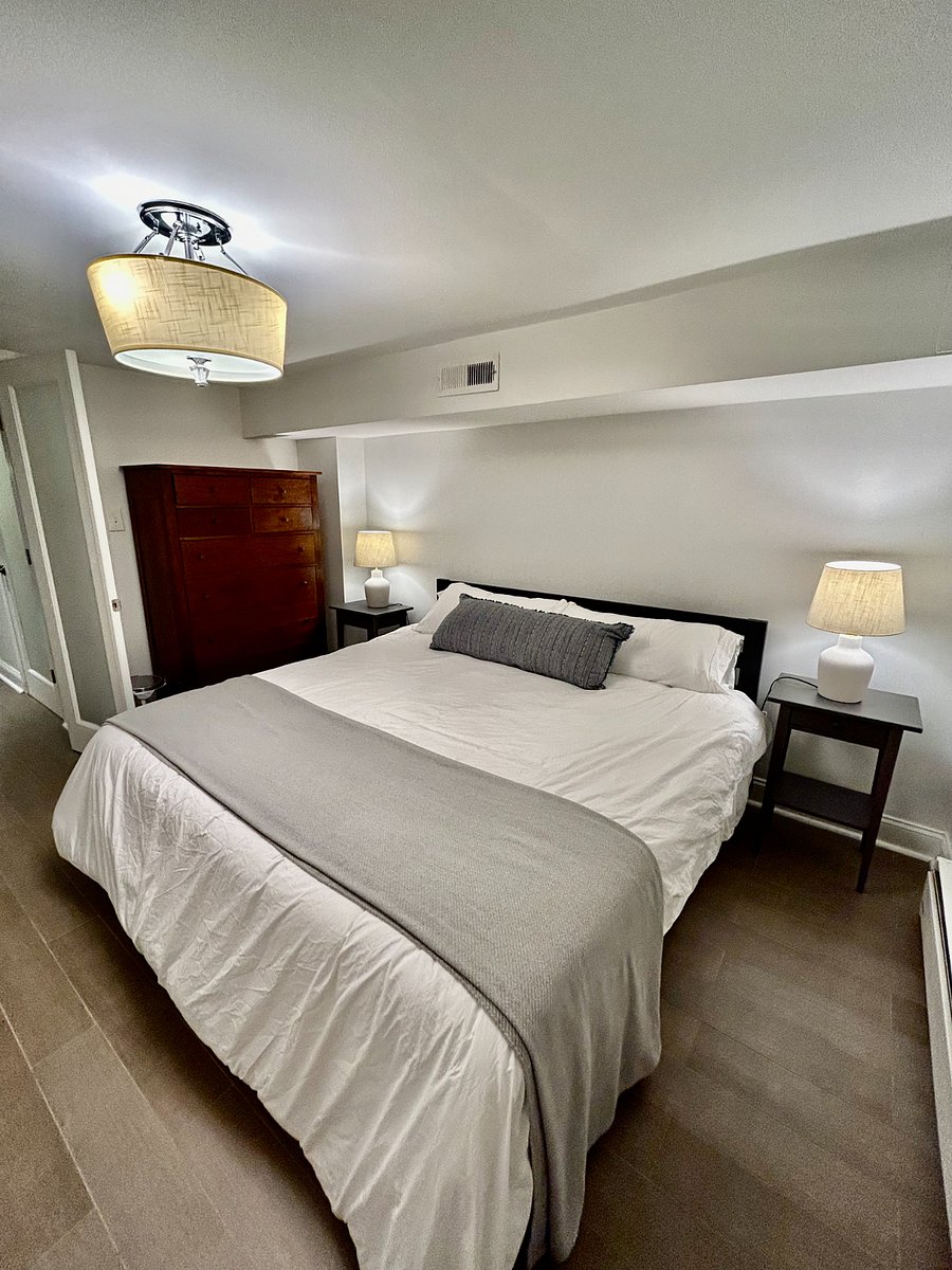 King-sized bed with full-sized chest of drawers.
